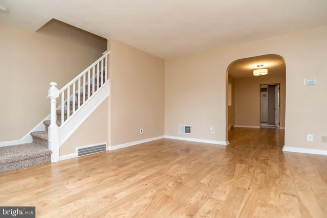 a view of an entryway with wooden floor