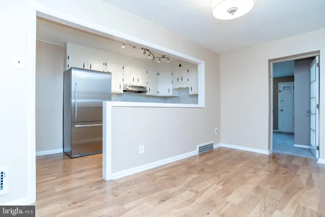 a view of kitchen with wooden floor