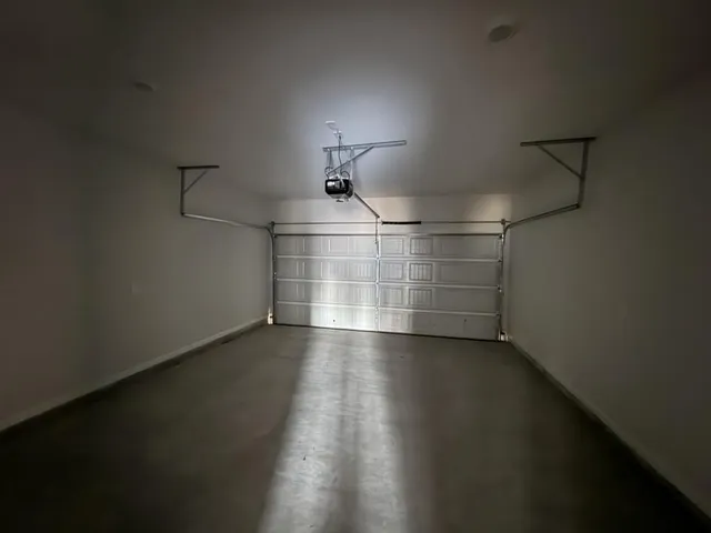 a room with hard wood floors and a window