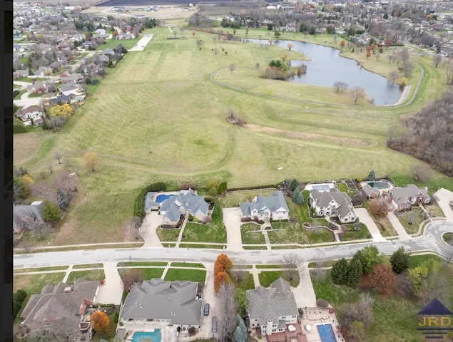 a bathroom with a bathtub and a garden view