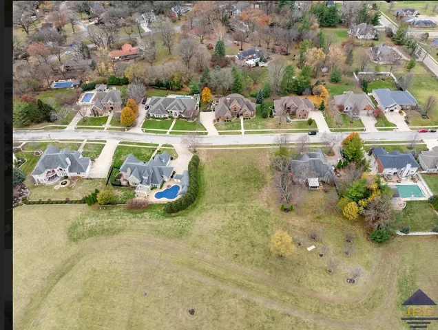 a view of swimming pool with a garden and seating area