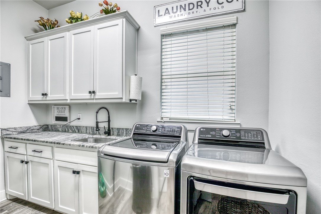 264 Farm To Market 833 Streetman, TX 75859 - Photo 15 of 19 a kitchen with appliances cabinets and a window