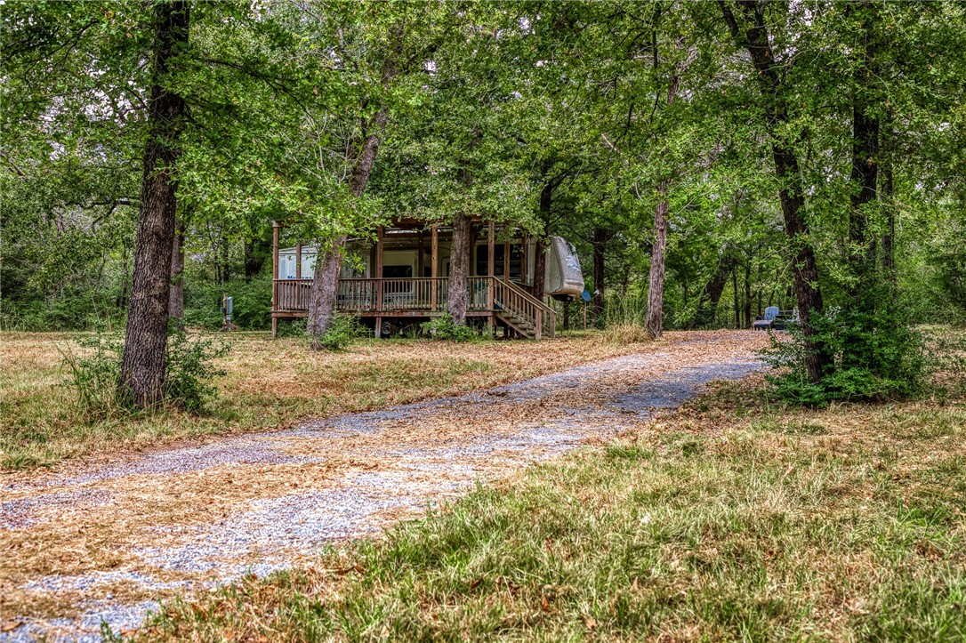 264 Farm To Market 833 Streetman, TX 75859 - Photo 18 of 19 a backyard of a house with seating space