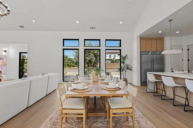 a kitchen with stainless steel appliances granite countertop sink stove top oven and cabinets
