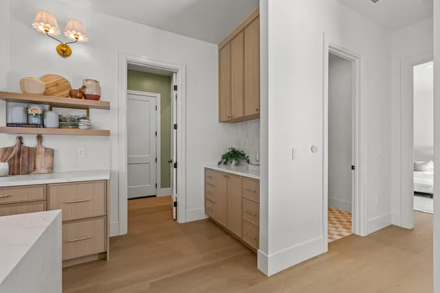 a bathroom with a double vanity sink a mirror and a bathtub