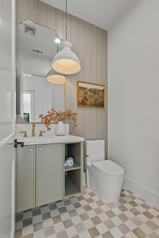 a bathroom with a granite countertop sink a toilet and bathtub