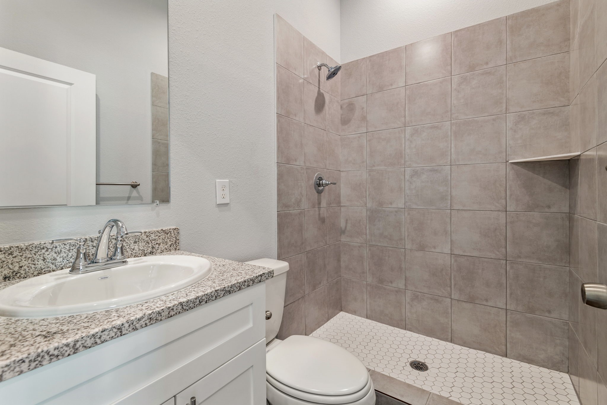 4934 Paradigm Ln Spring Spring, TX 77379 - Photo 12 of 14 a bathroom with a granite countertop sink toilet a mirror and shower