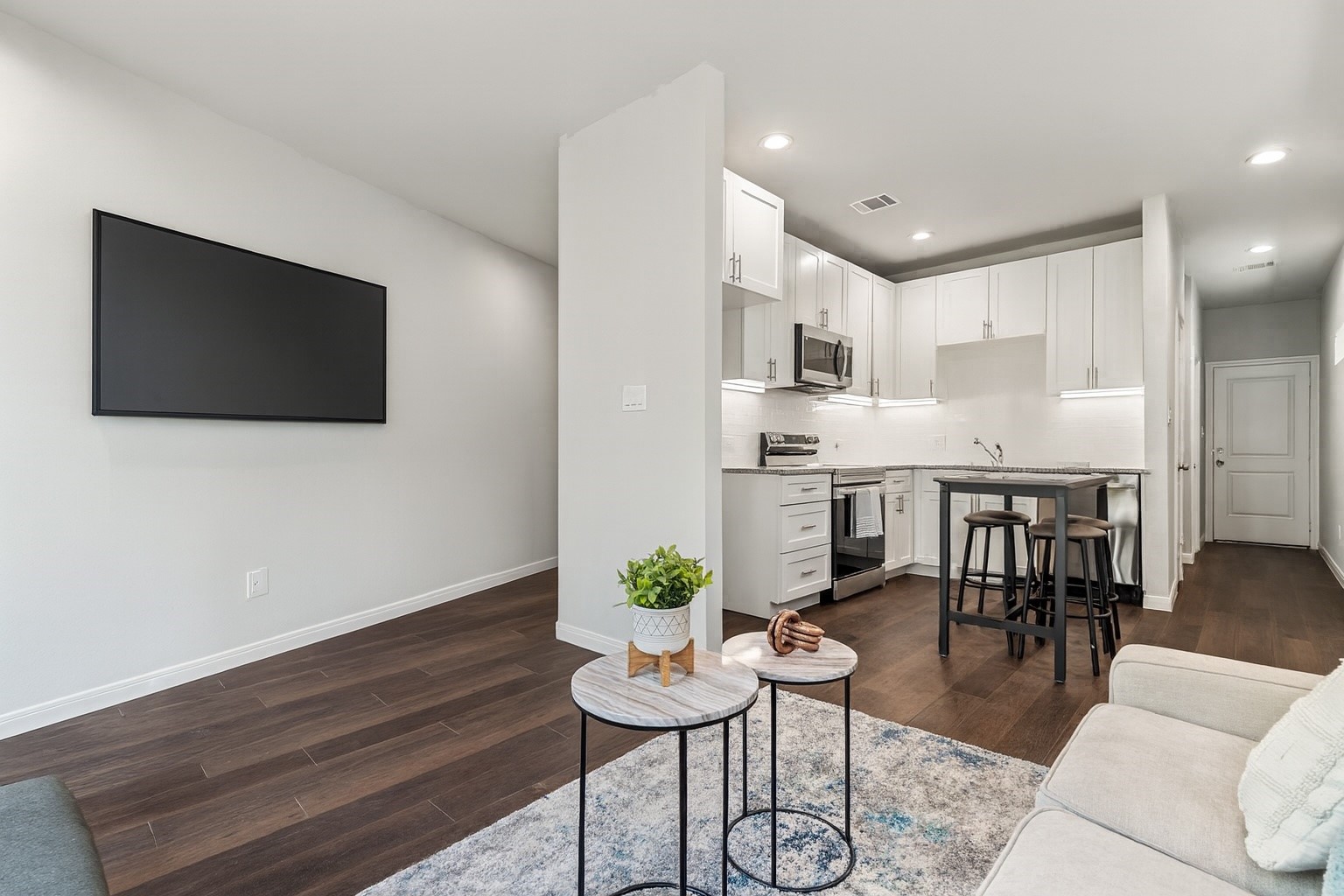 4934 Paradigm Ln Spring Spring, TX 77379 - Photo 8 of 14 a living room with furniture and a flat screen tv