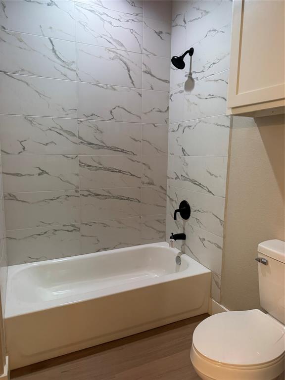 143 Ridge Road Tuscola, TX 79562 - Photo 20 of 24 a bathroom with a white toilet and a bathtub