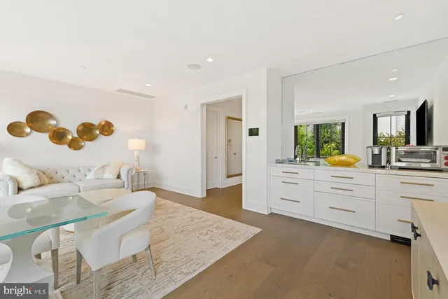 a building outdoor space with patio furniture and potted plants