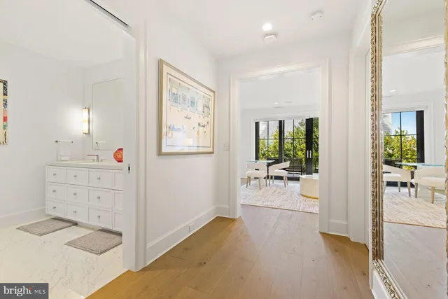 a view of a glass door and chair in the balcony
