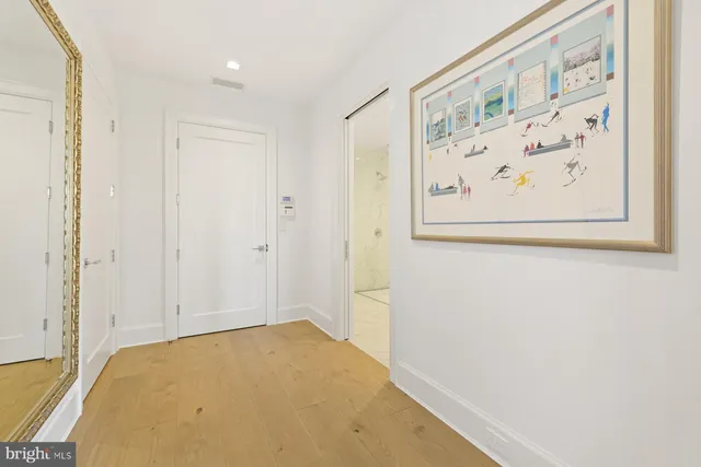 a front view of a house with a garden and plants