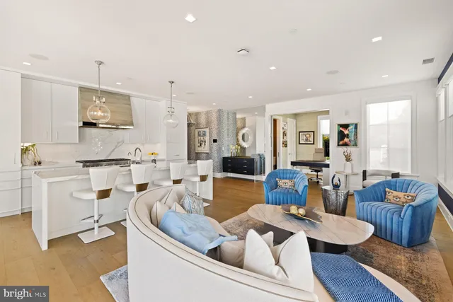 a living room with fireplace furniture and a flat screen tv