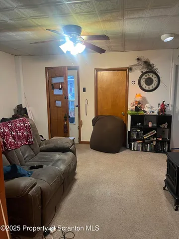 a room with wooden floor and cabinets