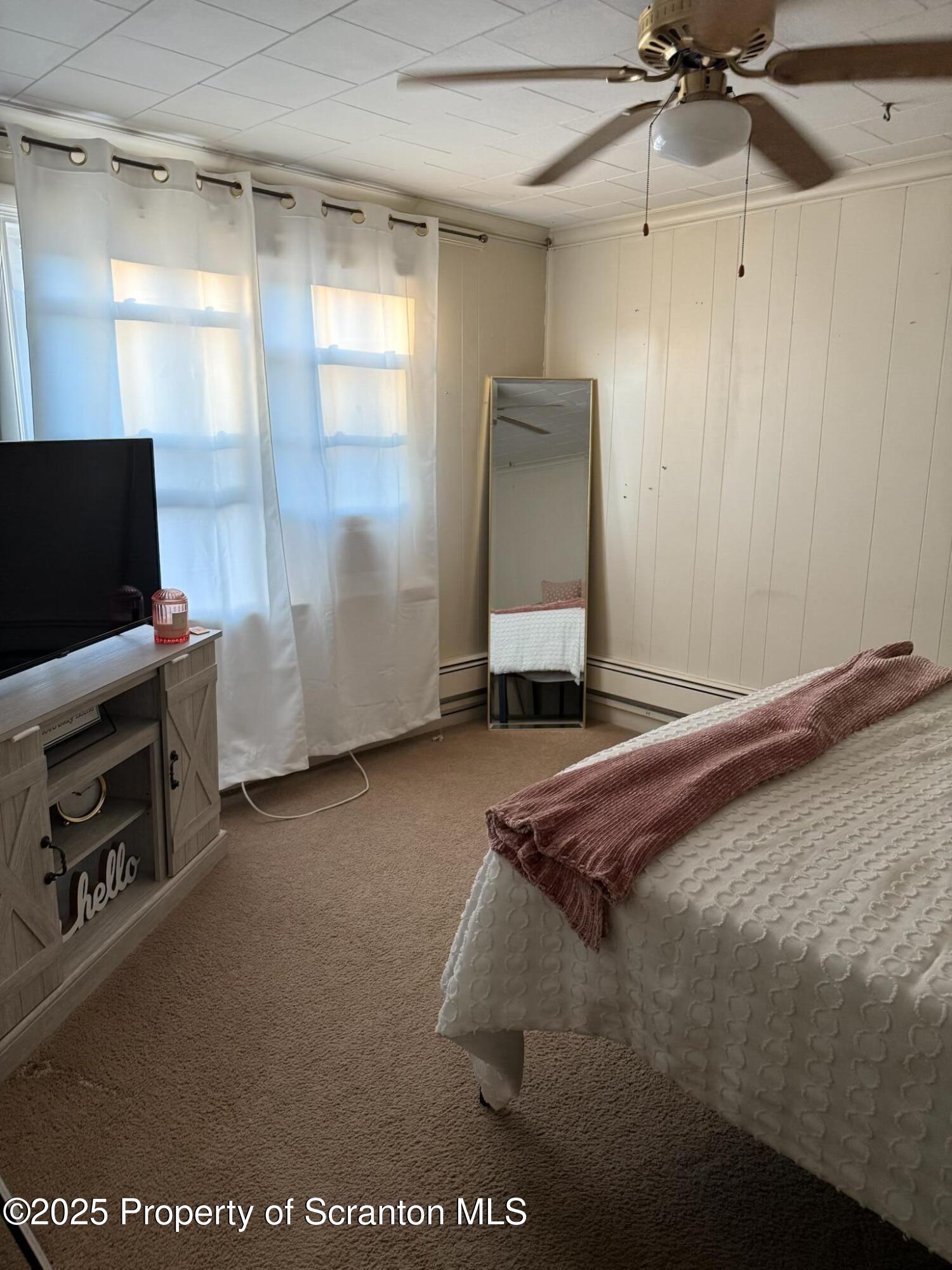 108 3rd Street Blakely, PA 18447 - Photo 23 of 27 a bedroom with a bed and a flat screen tv