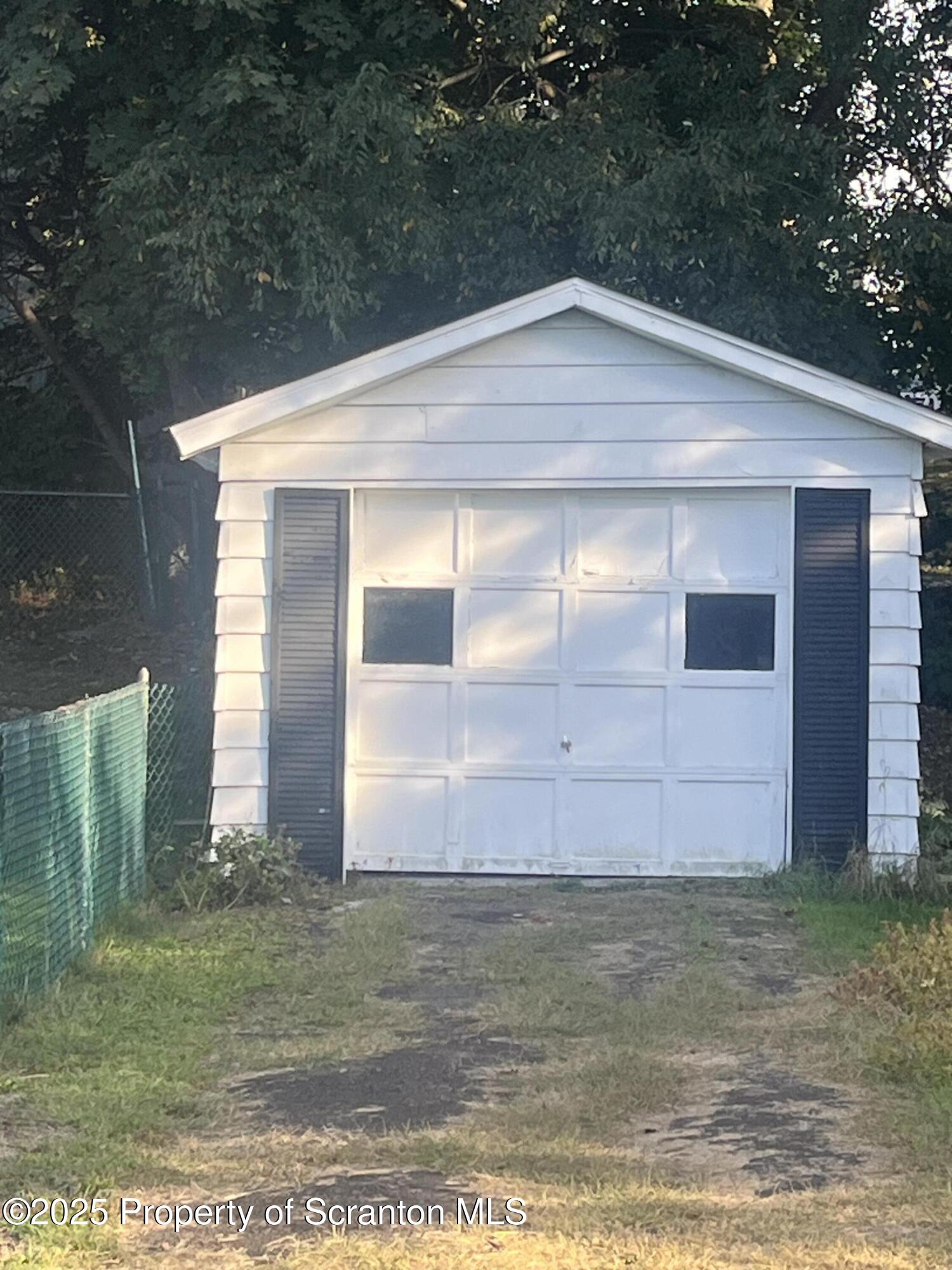 108 3rd Street Blakely, PA 18447 - Photo 26 of 27 a front view of house with yard
