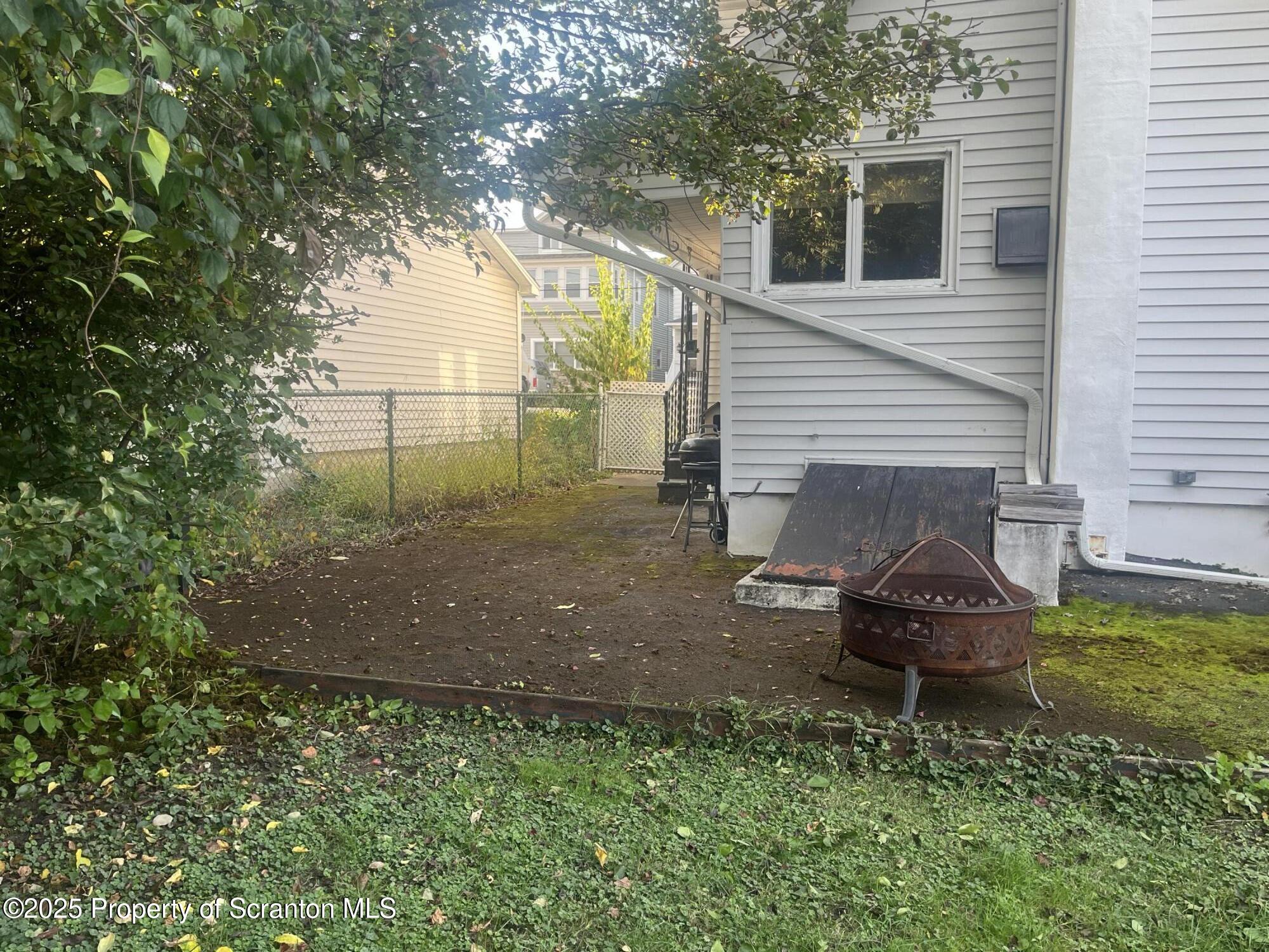 108 3rd Street Blakely, PA 18447 - Photo 7 of 27 a backyard of a house with seating space