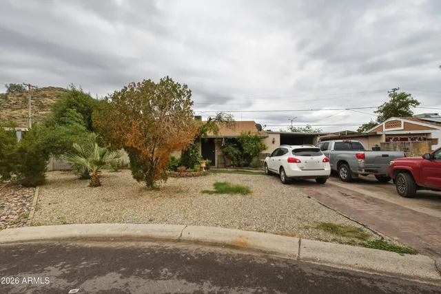 a view of cars parked on the side of a street