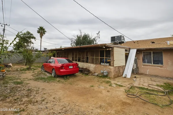 a front view of a house with parking space
