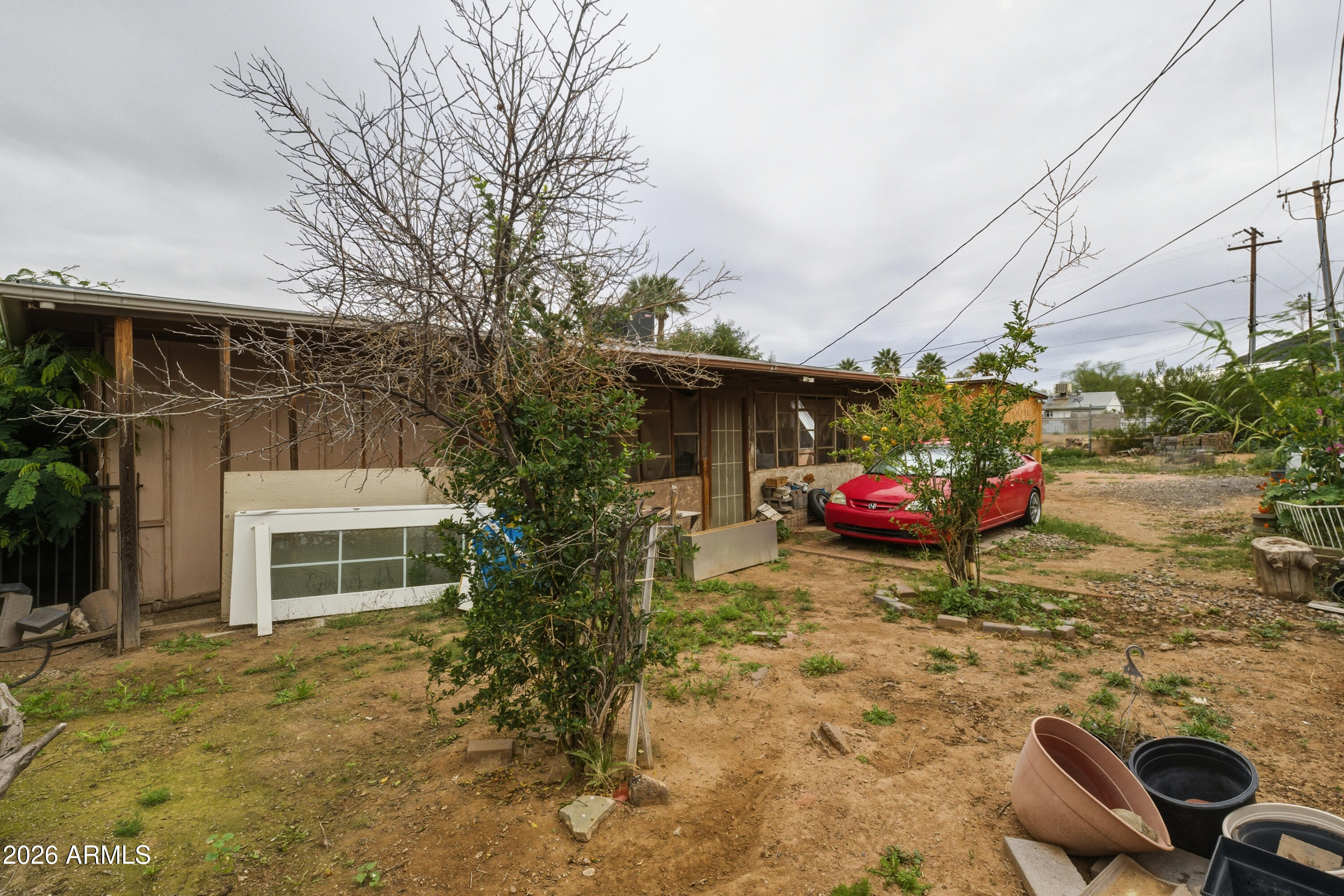 10013 North 16th Avenue Phoenix, AZ 85021 - Photo 16 of 18 a view of a house with a yard