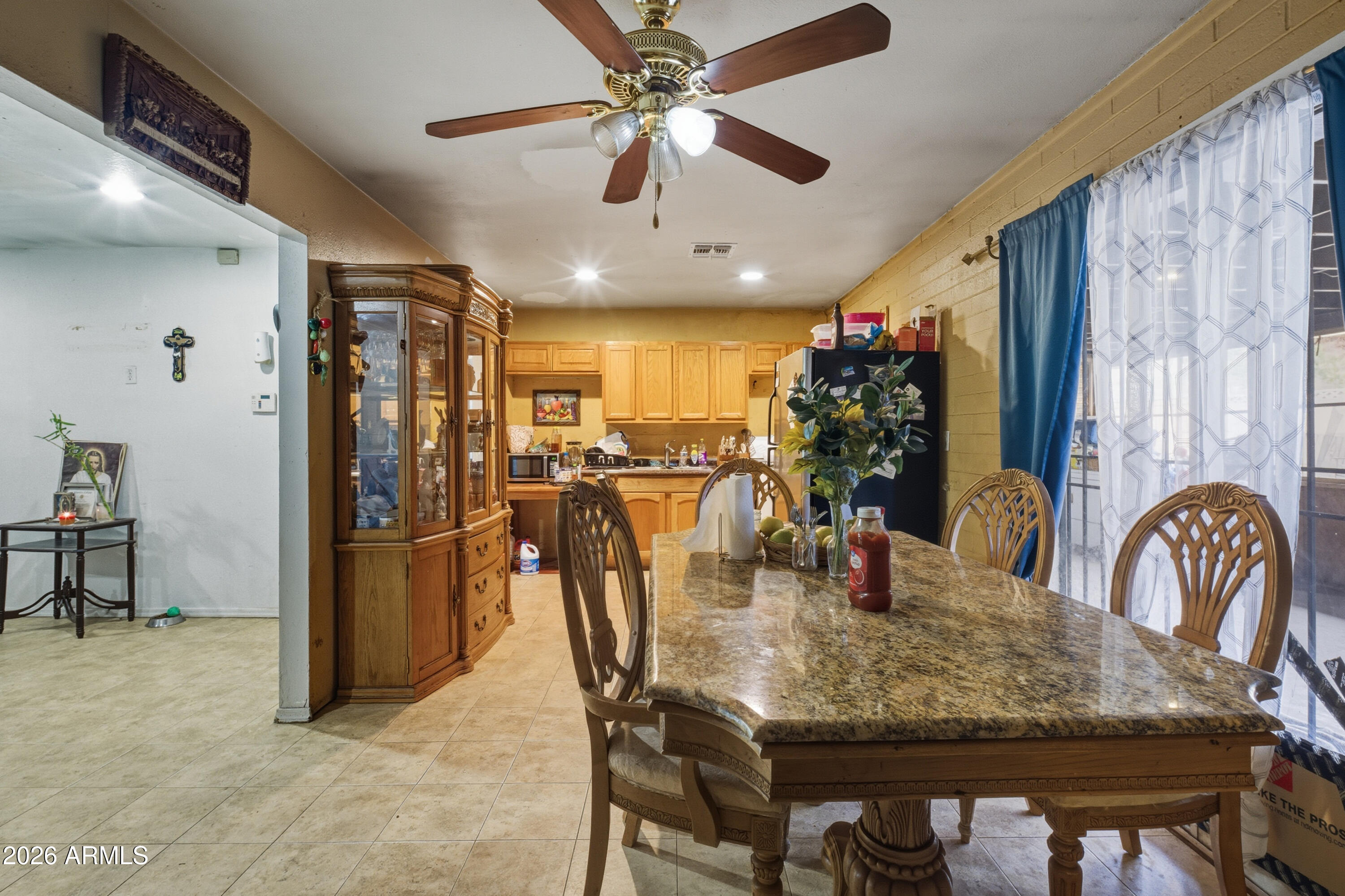 10013 North 16th Avenue Phoenix, AZ 85021 - Photo 6 of 18 a dining room with furniture and window