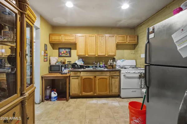 a kitchen with a refrigerator and countertop