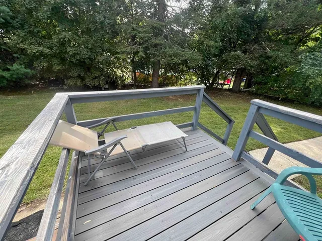 a view of sitting area with furniture in backyard