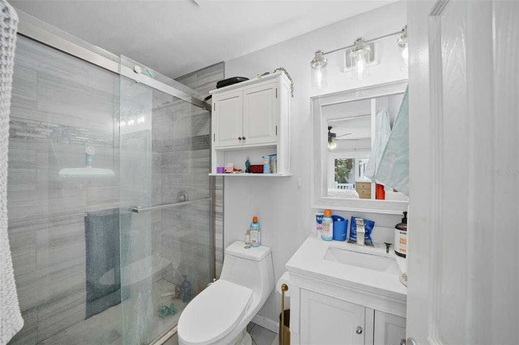 15823 Redington Drive Redington Beach, FL 33708 - Photo 15 of 39 a bathroom with a sink a toilet and shower