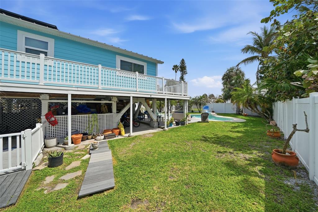 15823 Redington Drive Redington Beach, FL 33708 - Photo 21 of 39 a view of a house with a yard porch and sitting area