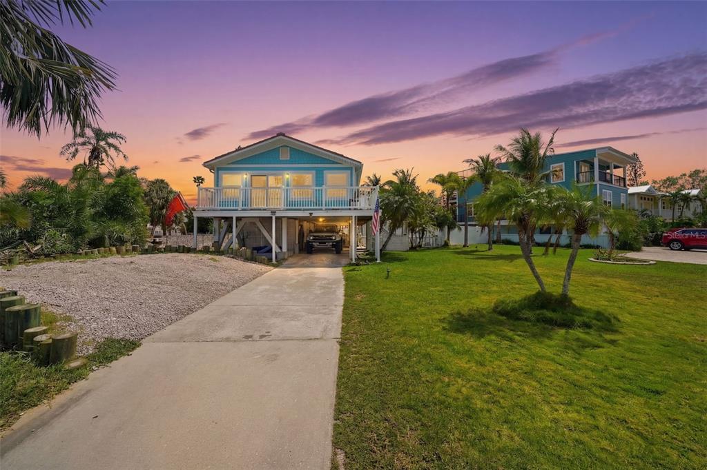 15823 Redington Drive Redington Beach, FL 33708 - Photo 3 of 39 a view of a house with a backyard