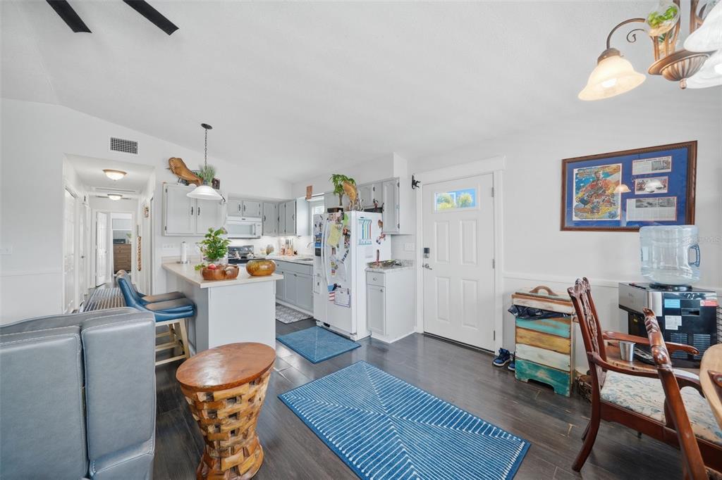 15823 Redington Drive Redington Beach, FL 33708 - Photo 5 of 39 a living room with furniture and a dining table