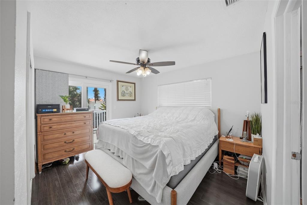 15823 Redington Drive Redington Beach, FL 33708 - Photo 9 of 39 a bedroom with a bed and a table in it