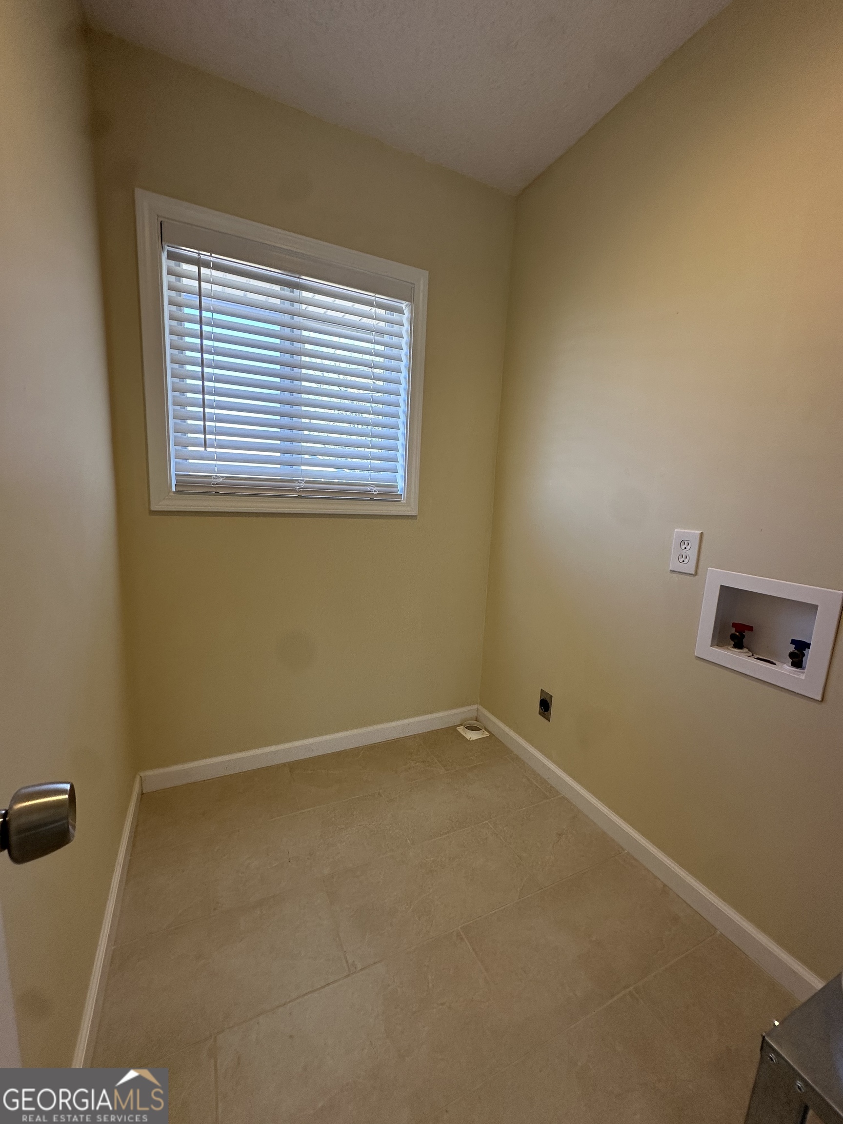 306 Garner Street Thomaston, GA 30286 - Photo 13 of 59 a view of an empty room with a window