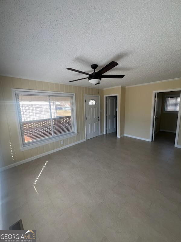 306 Garner Street Thomaston, GA 30286 - Photo 15 of 59 a view of an empty room with a fireplace and a window