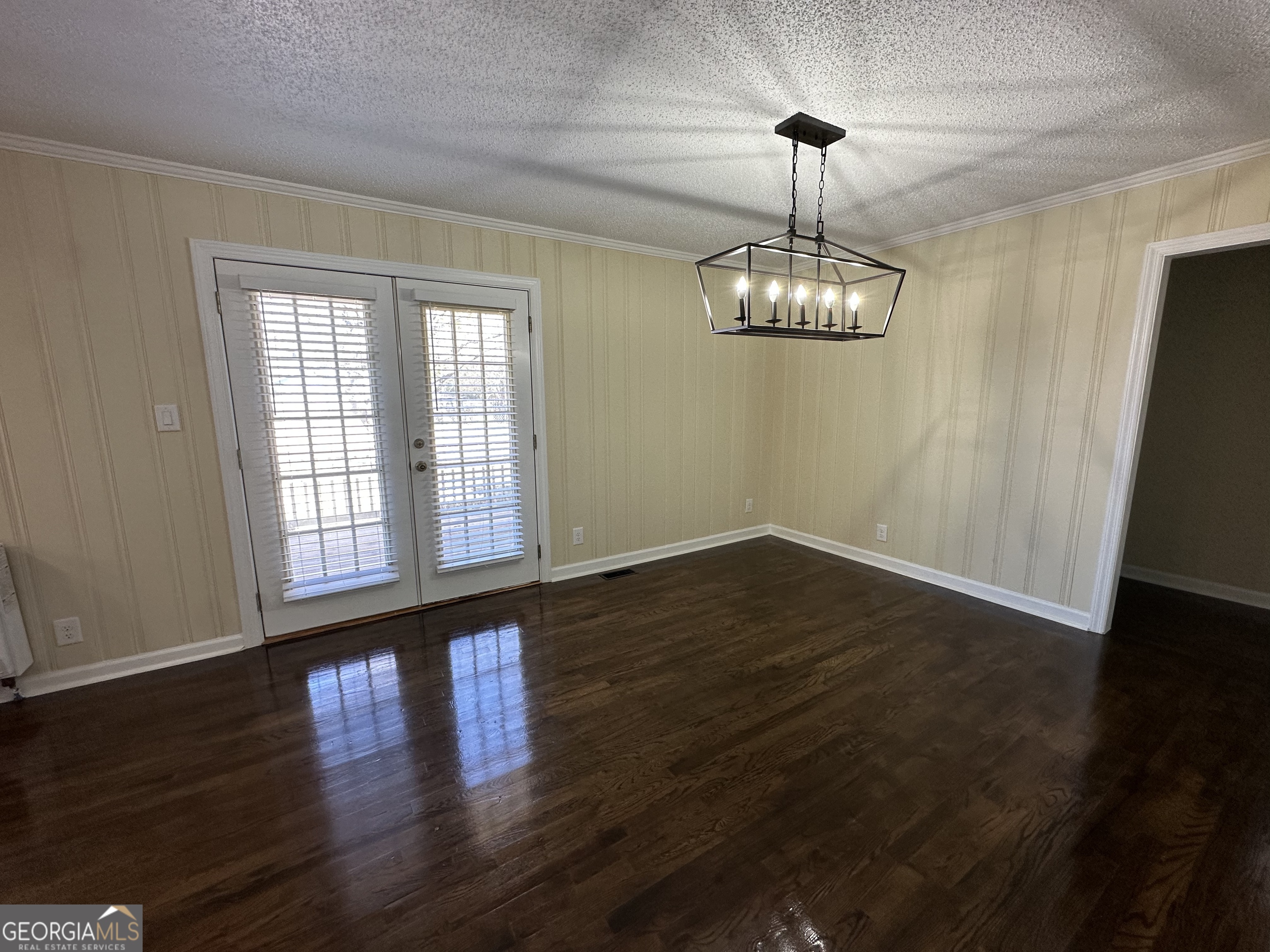 306 Garner Street Thomaston, GA 30286 - Photo 23 of 59 a view of empty room with wooden floor and window