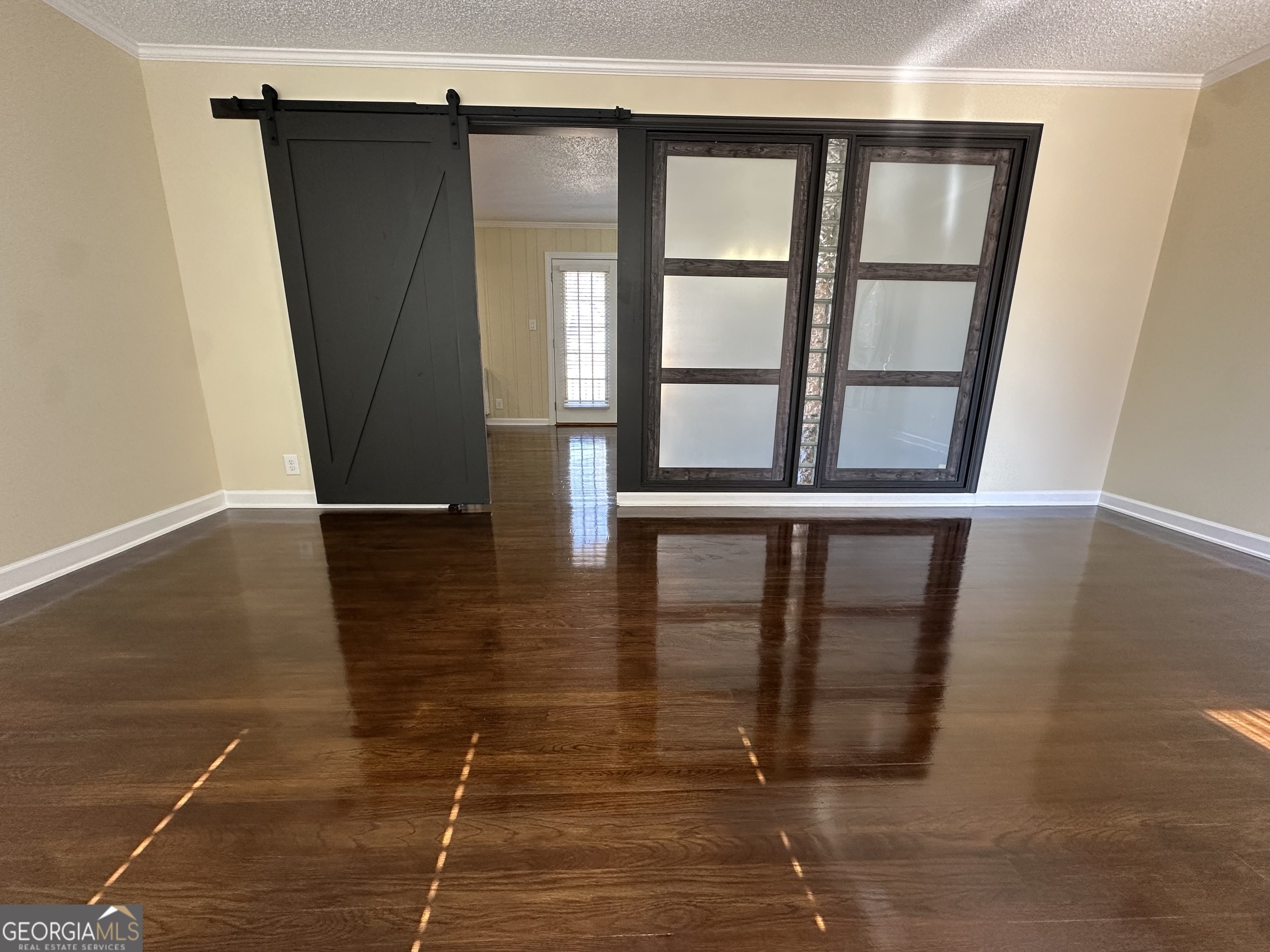 306 Garner Street Thomaston, GA 30286 - Photo 27 of 59 a view of empty room with wooden floor and fan