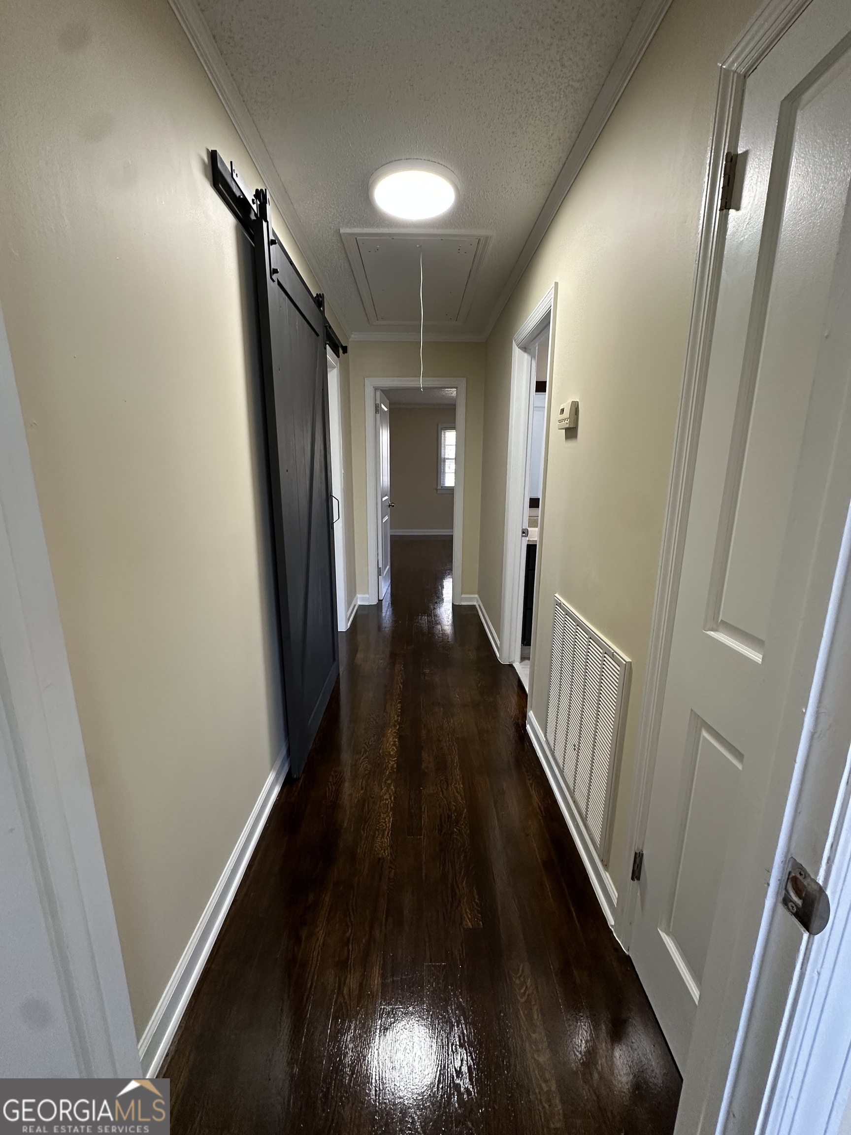 306 Garner Street Thomaston, GA 30286 - Photo 37 of 59 a view of a hallway with wooden floor
