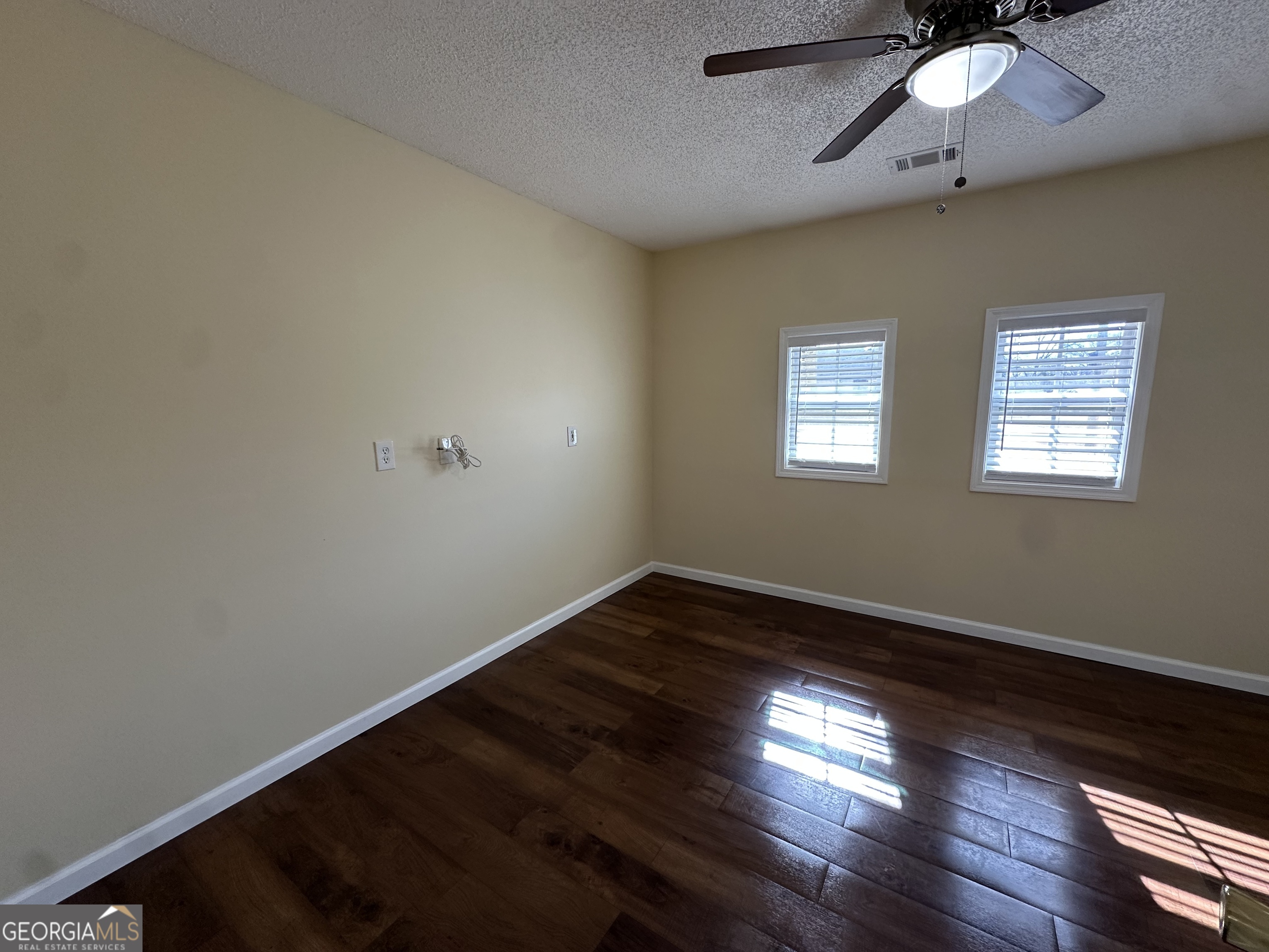 306 Garner Street Thomaston, GA 30286 - Photo 53 of 59 a view of an empty room with wooden floor and a window