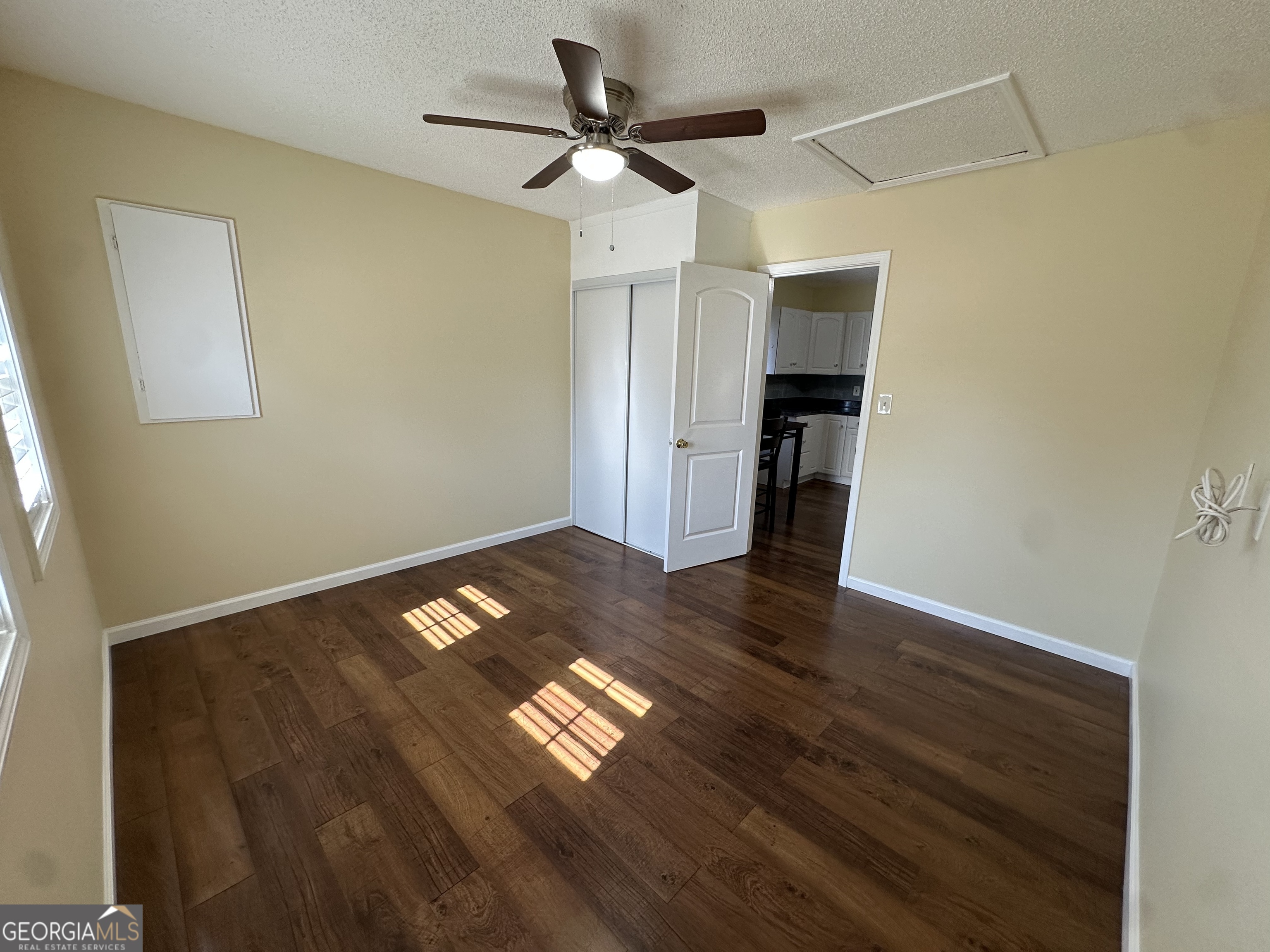 306 Garner Street Thomaston, GA 30286 - Photo 55 of 59 a view of empty room with wooden floor and fan