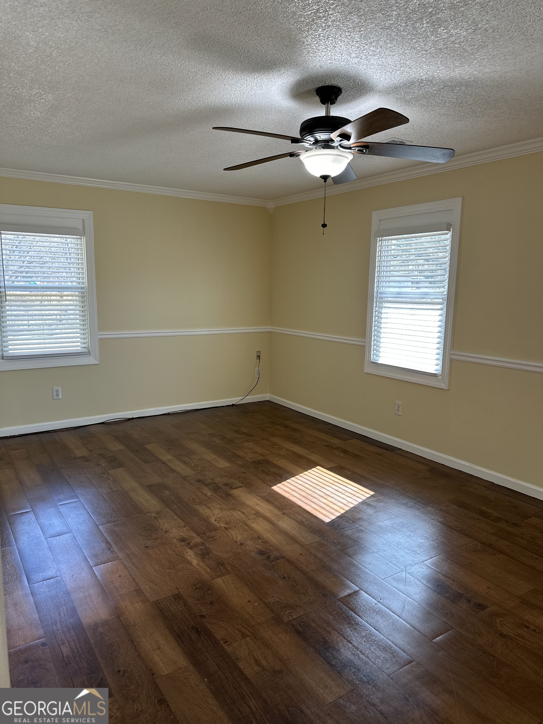 306 Garner Street Thomaston, GA 30286 - Photo 56 of 59 a view of a room with wooden floor and ceiling fan
