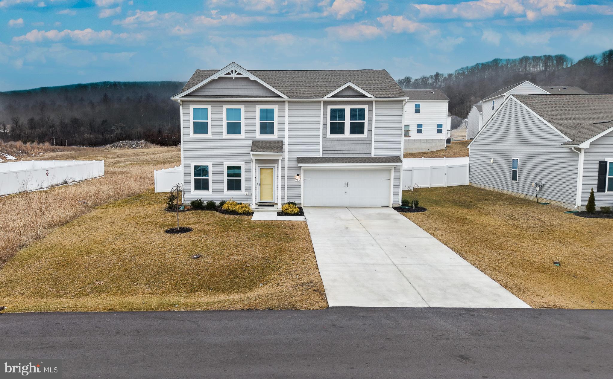 154 Diving Scaup Road Hedgesville, WV 25427 - Photo 1 of 57 a view of a big house with wooden fence