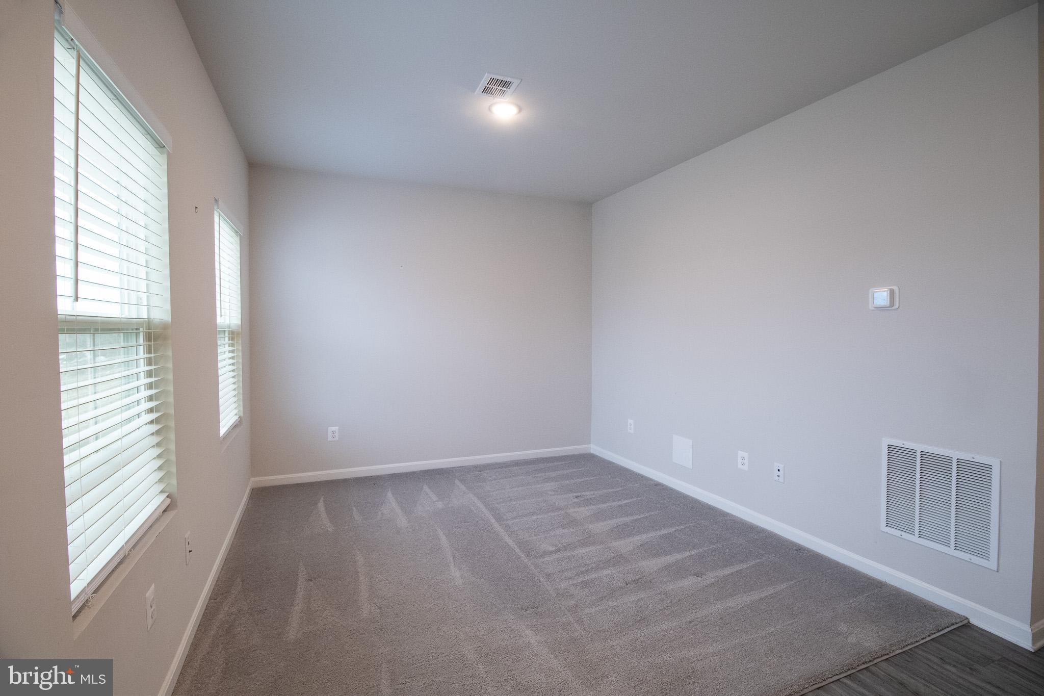 154 Diving Scaup Road Hedgesville, WV 25427 - Photo 14 of 57 a view of an empty room with a window