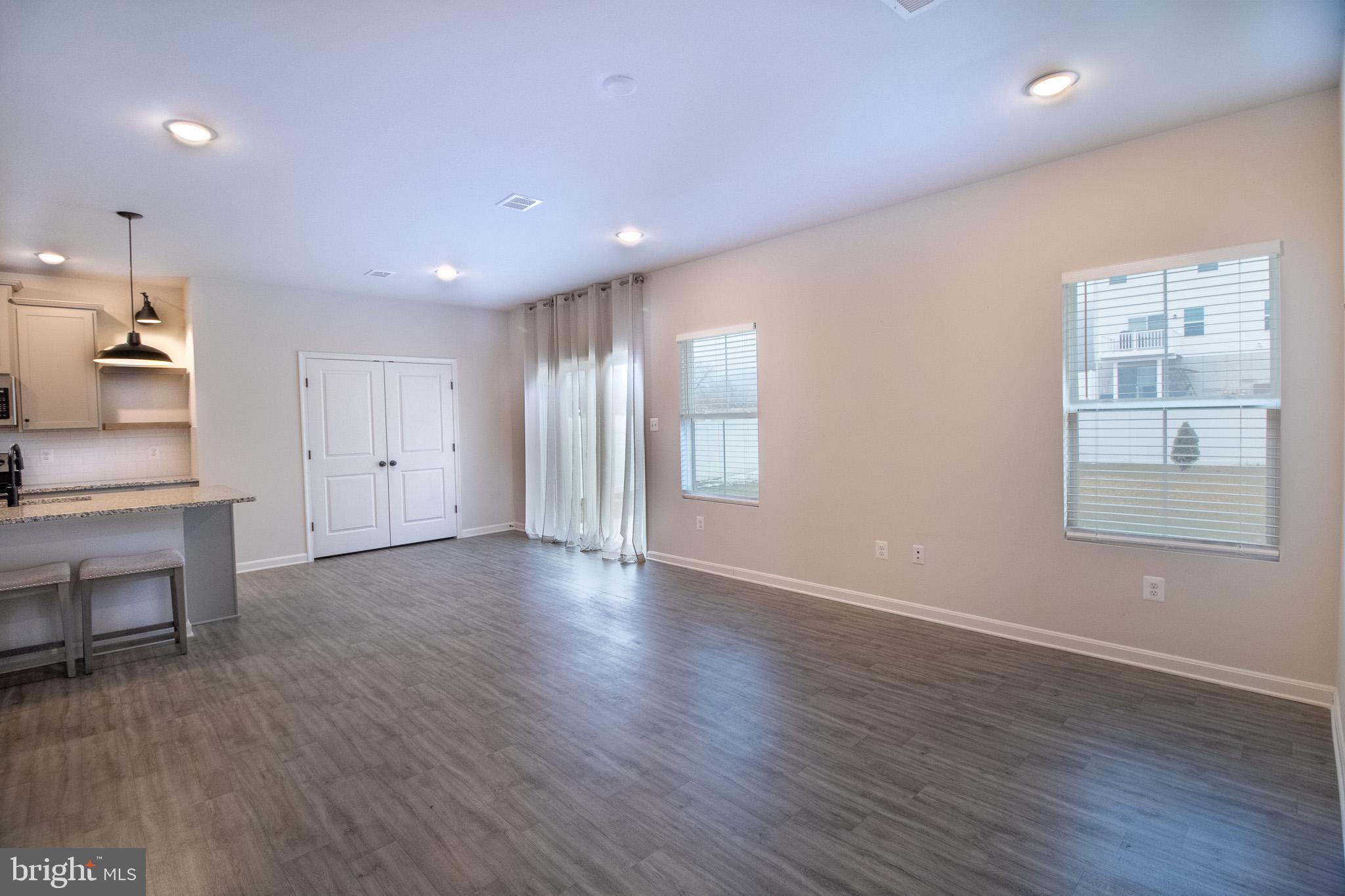 154 Diving Scaup Road Hedgesville, WV 25427 - Photo 24 of 57 a view of an empty room with wooden floor and a window