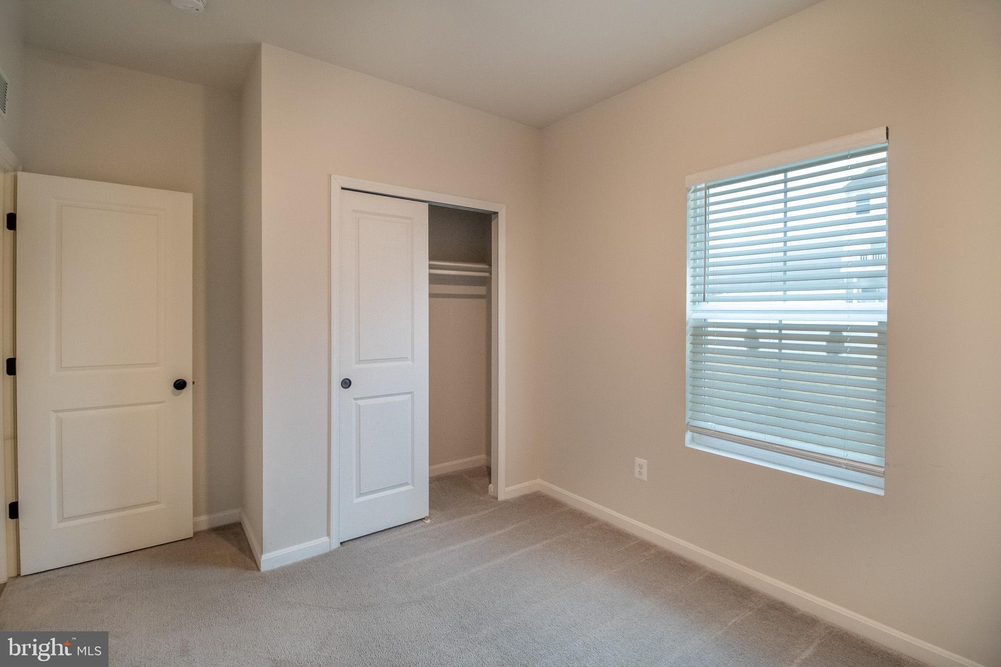 154 Diving Scaup Road Hedgesville, WV 25427 - Photo 26 of 57 a view of an empty room with closet and a window
