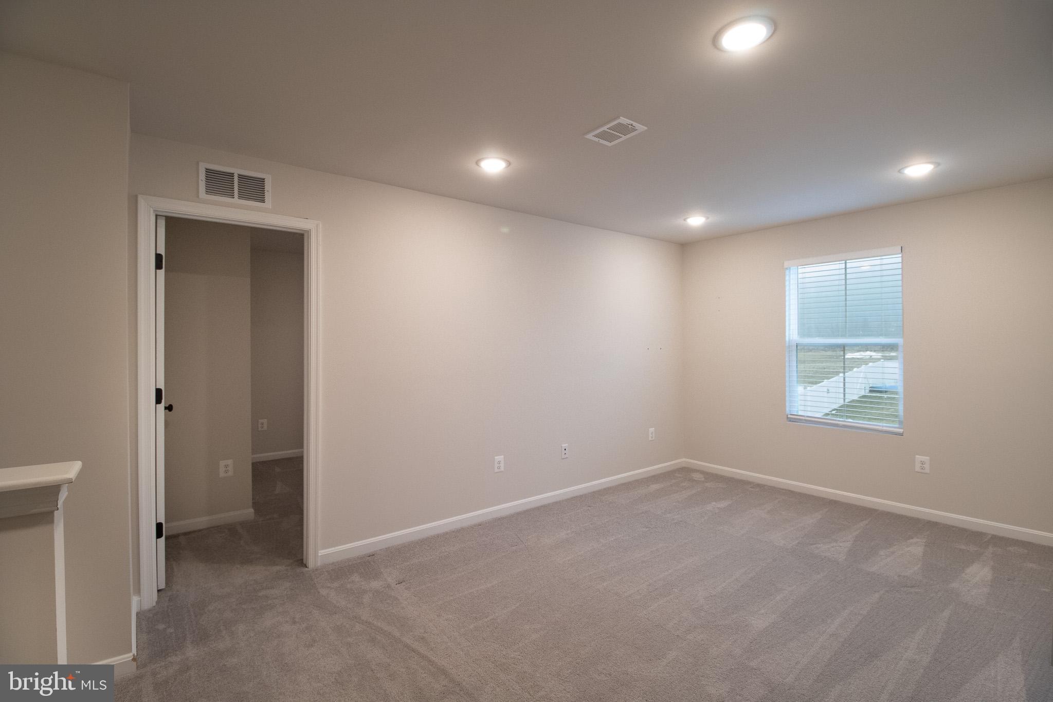 154 Diving Scaup Road Hedgesville, WV 25427 - Photo 31 of 57 an empty room with windows and closet