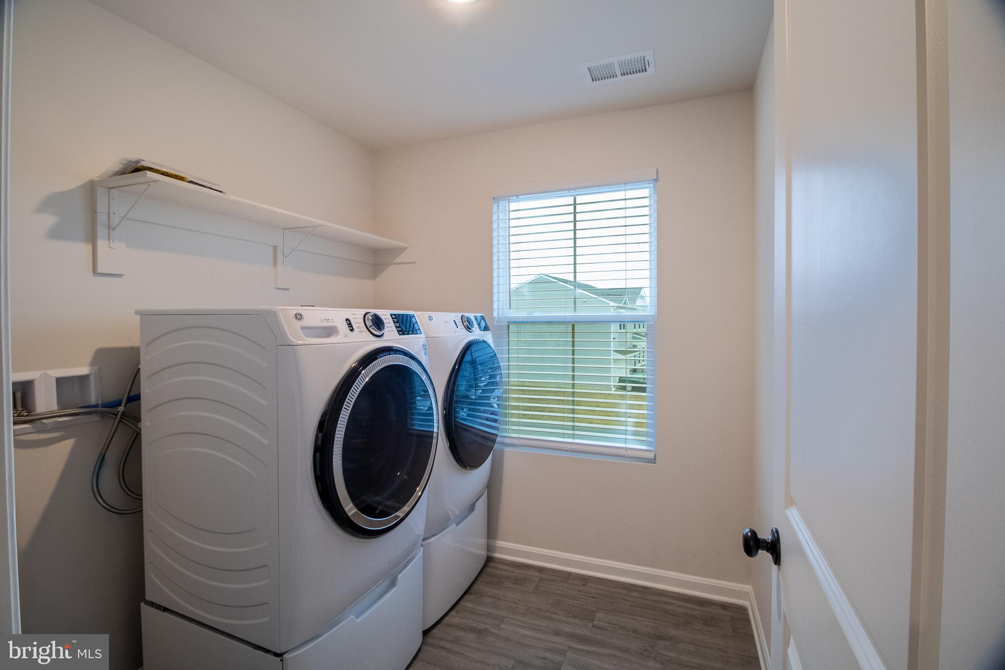 154 Diving Scaup Road Hedgesville, WV 25427 - Photo 47 of 57 a utility room with dryer and washer