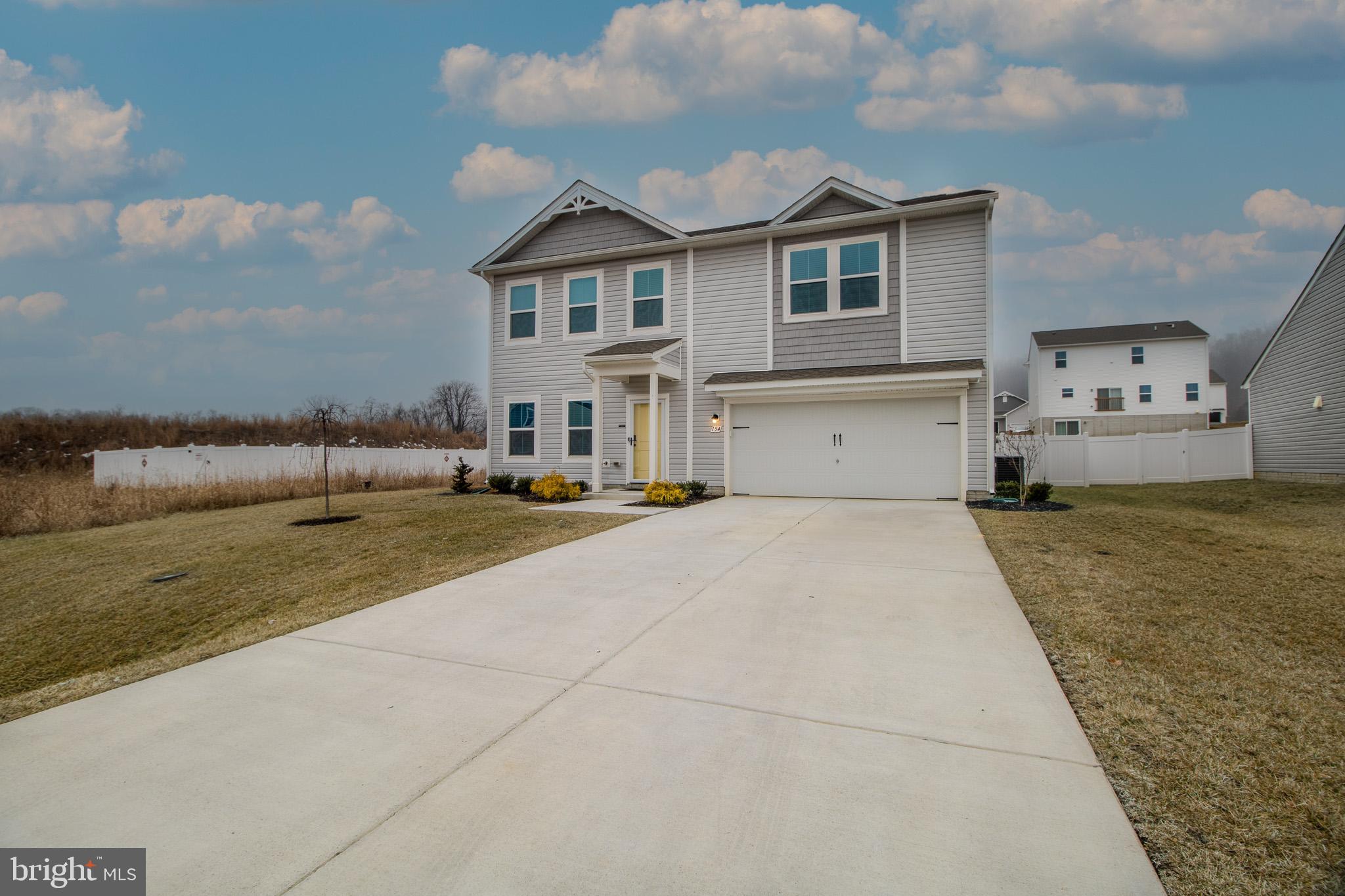 154 Diving Scaup Road Hedgesville, WV 25427 - Photo 50 of 57 a front view of a house with a yard