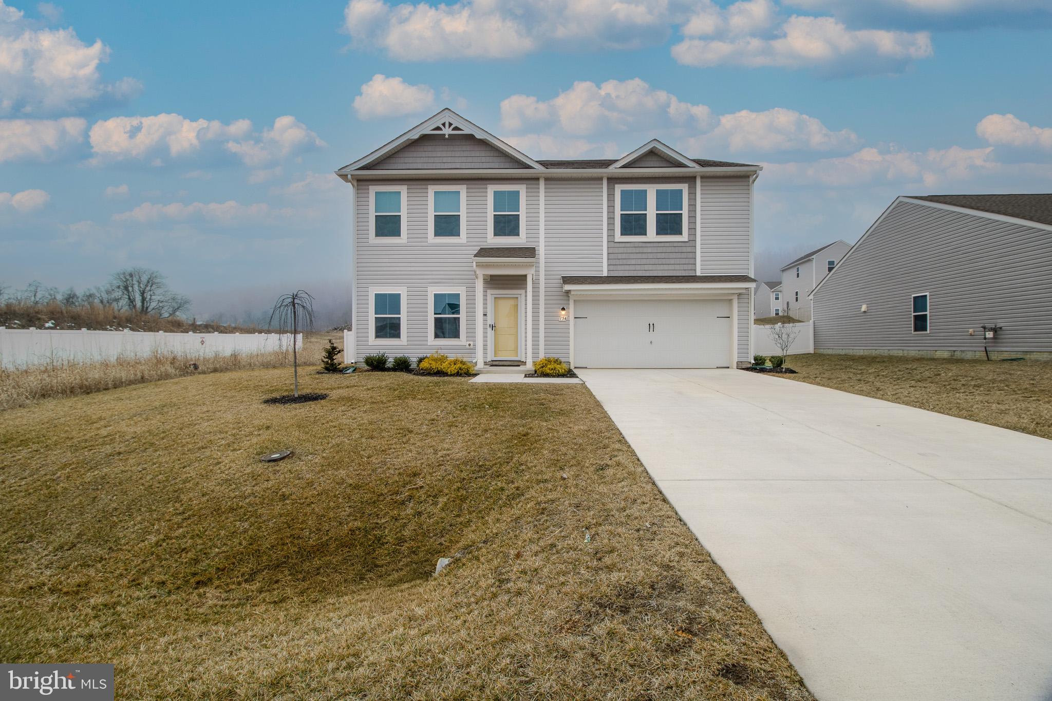 154 Diving Scaup Road Hedgesville, WV 25427 - Photo 51 of 57 a front view of a house with a yard