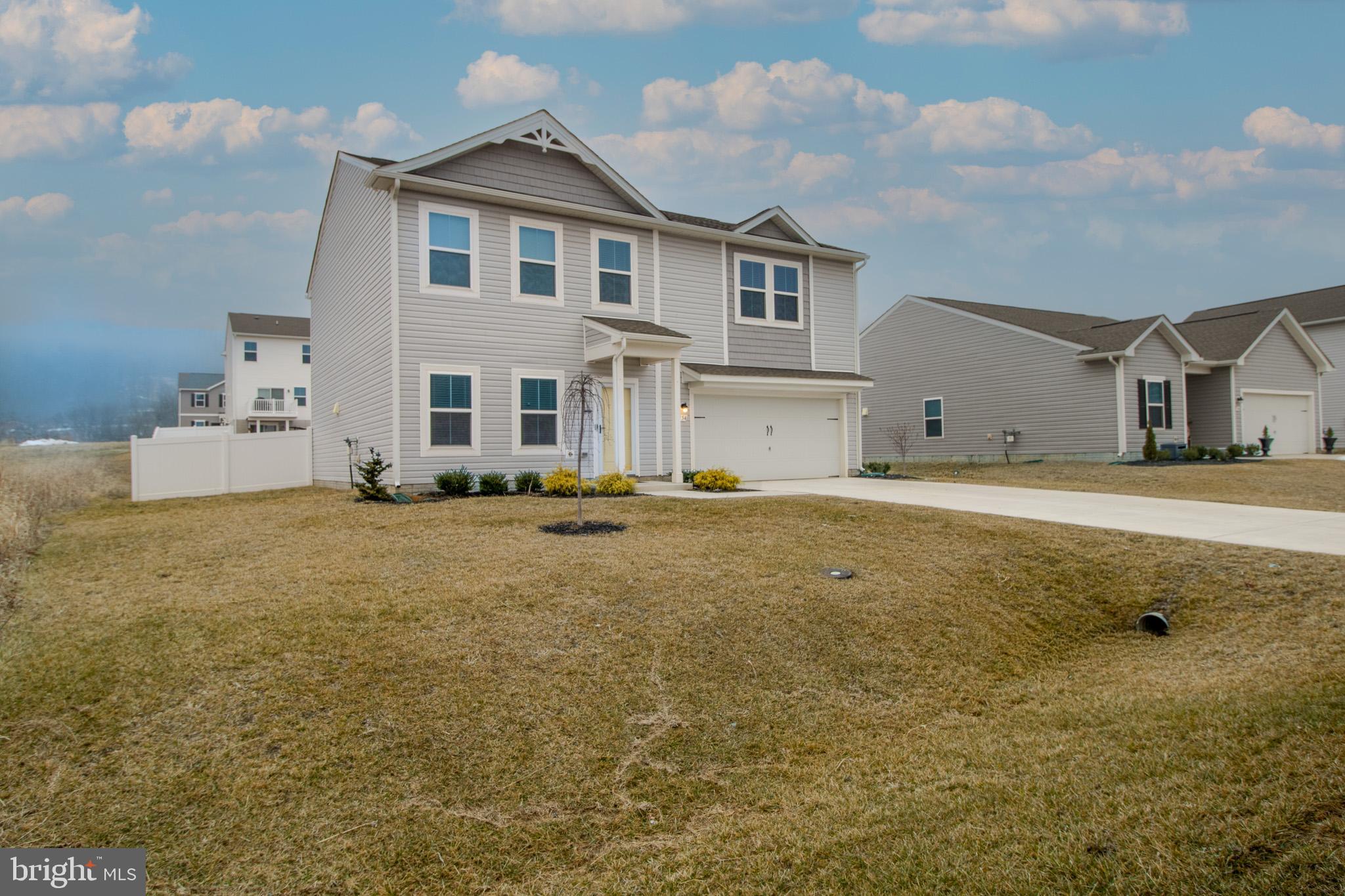 154 Diving Scaup Road Hedgesville, WV 25427 - Photo 52 of 57 a front view of a house with a yard