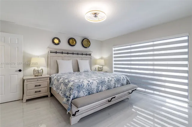 a bedroom with a bed and a cabinets